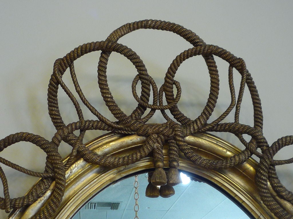 A Large Oval English Rope Twist Carved and Gilt Mirror