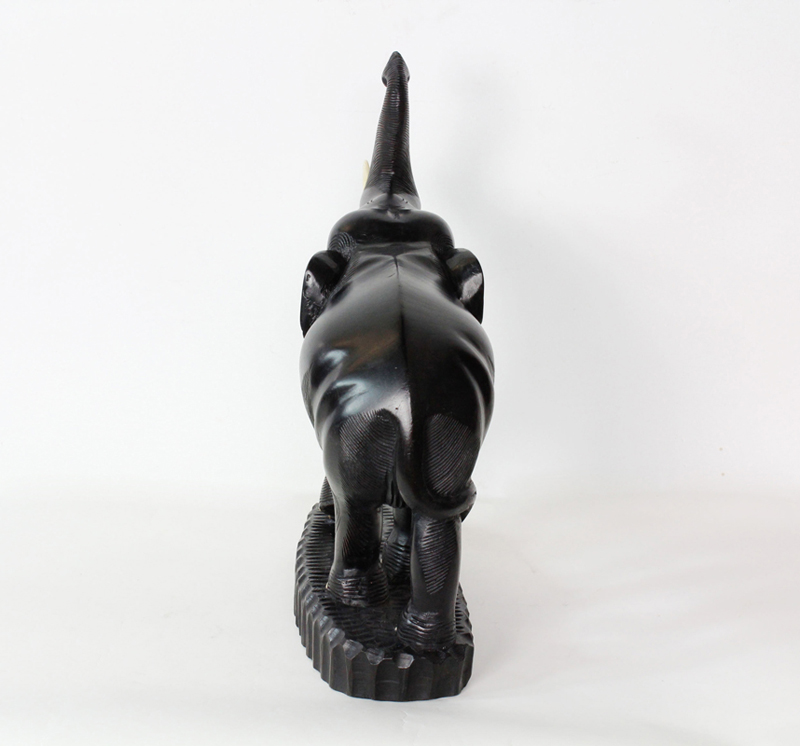 A Large Carved Indian Elephant with Raised Trunk