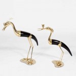 A Pair of Faux Horn and Metal Heron Form Candlesticks