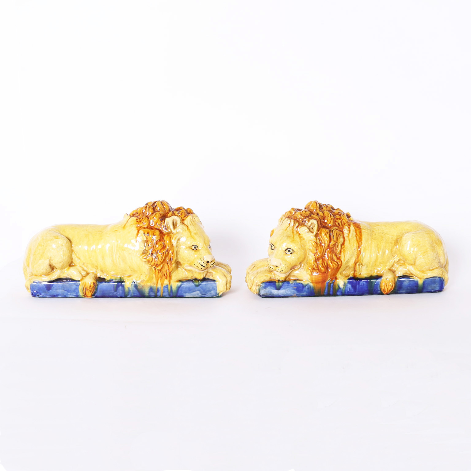 Pair of Antique Italian Glazed Earthenware Recumbent Lions