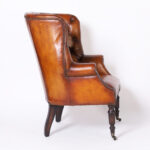 Pair of Leather Button Tufted Wingback British Colonial Style Armchairs